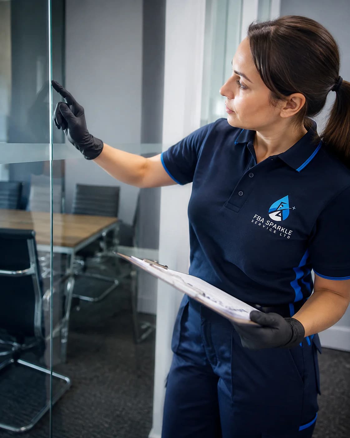 An FBA Sparkle supervisor checking a completed clean against a written room-by-room checklist